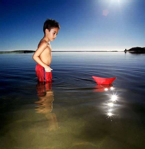 Photograph Karan Kapoor Boy With Paper Boat on One Eyeland