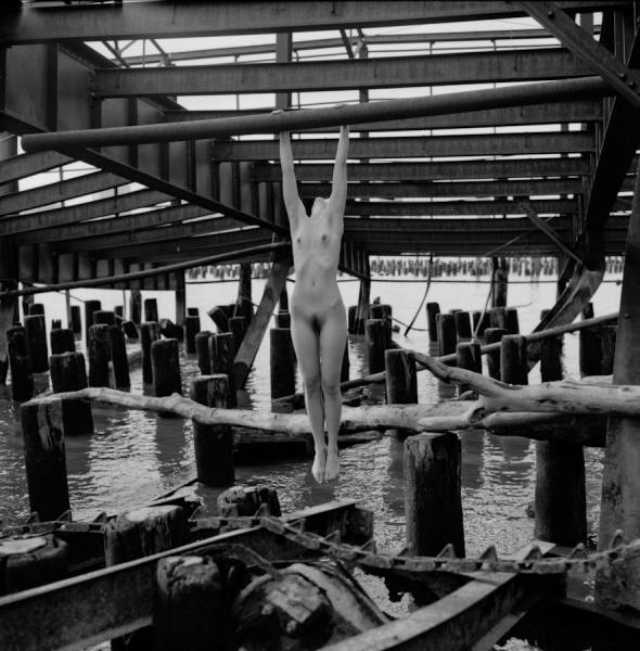 Photograph Scott Mcsorley Hanging Over Water on One Eyeland