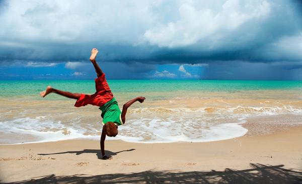 Photograph Jackson Carvalho Boy On The Beach on One Eyeland