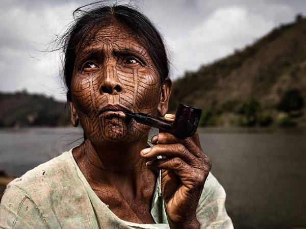 Photograph Suchet Suwanmongkol Smoking on One Eyeland