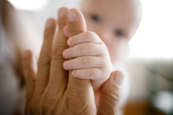 Photograph Jim Erickson View Of A Baby Holding An Adults Hand on One Eyeland