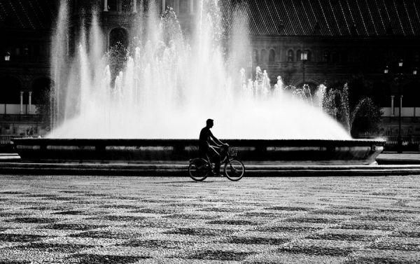 Photograph Eugenia Kyriakopoulou Cycling Through The Square on One Eyeland