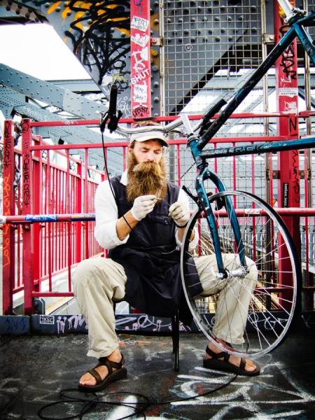 Photograph Laura Barisonzi Bike Mechanic on One Eyeland