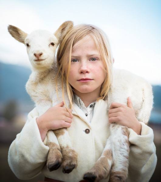 Photograph Tyler Stableford Girl With Lamb on One Eyeland