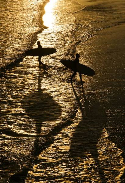 Photograph Andrew Lever Sunset Surfers on One Eyeland
