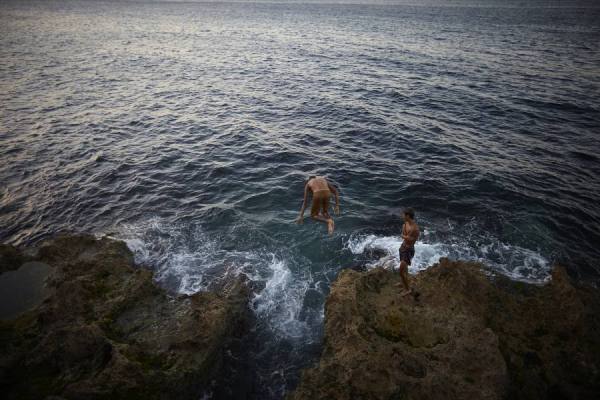 Photograph Dennis Welsh Swimming Off The Rocky Shores Of Havana Cuba on One Eyeland