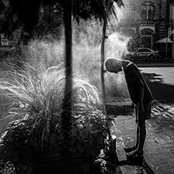 Boy at Fountain on a Hot Summer Day (Budapest, Hungary)-Scarlett Freund-finalist-black_and_white-15656