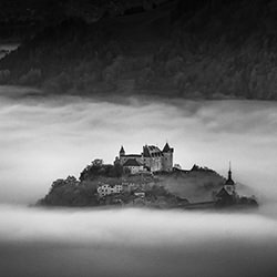 Castle of Gruyeres emerging out of a sea of fog-Emmanuel Egger-finalist-black_and_white-18427