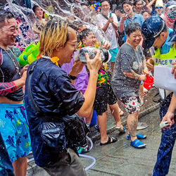 Police and civilians having fun at Hong Kong Songkran Festival-Howard Tong-finalist-street-11703
